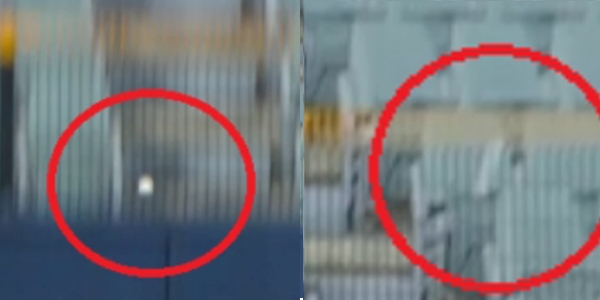 비디오판독 당시 장면. 정면에서 찍은 장면에서는 공이 철조망 앞으로 떨어지는 것처럼 보이지만, 측면에서 찍은 장면에서는 철조망 뒤로 공이 떨어지는 것처럼 보인다.